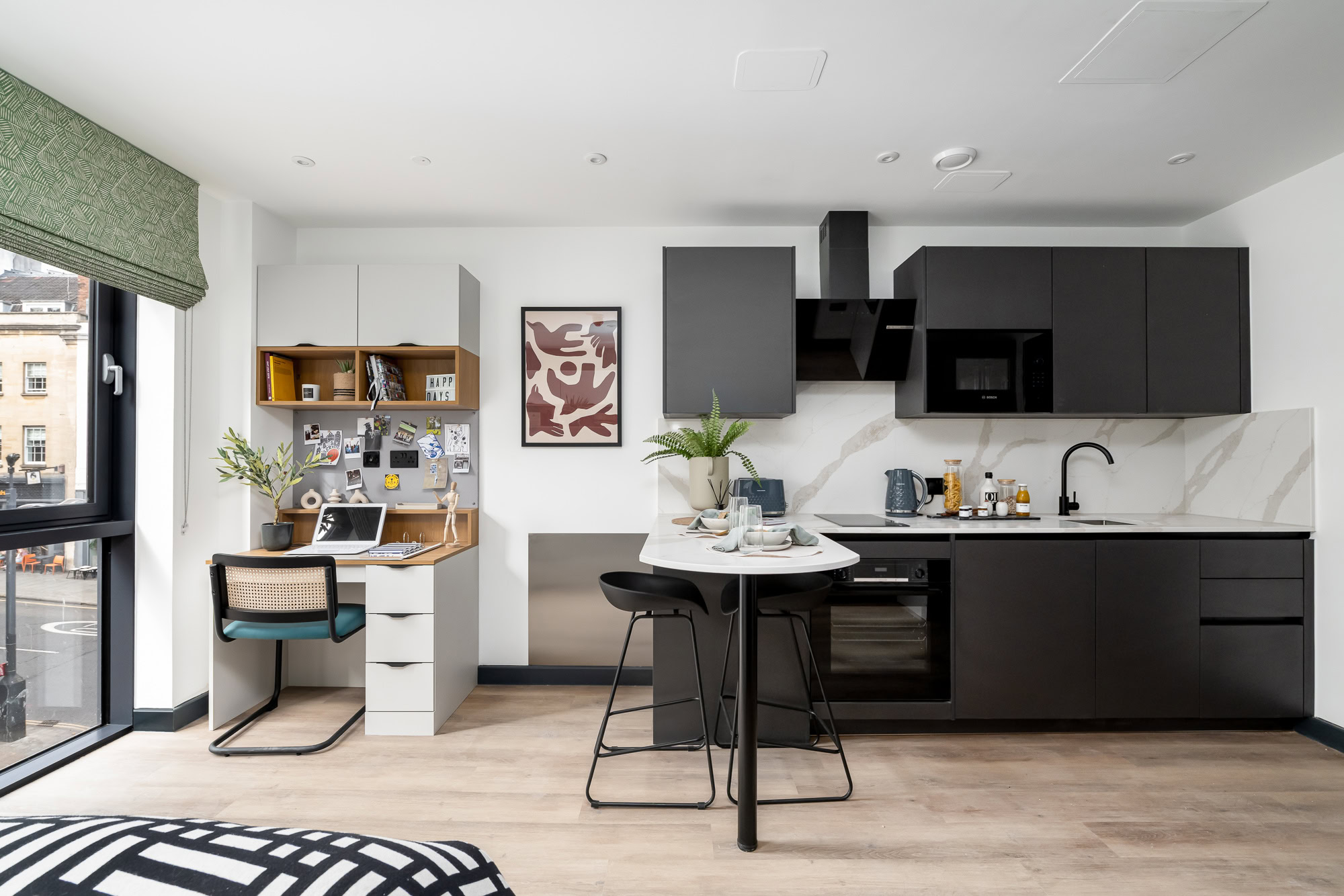 A kitchen and living room in a small apartment.