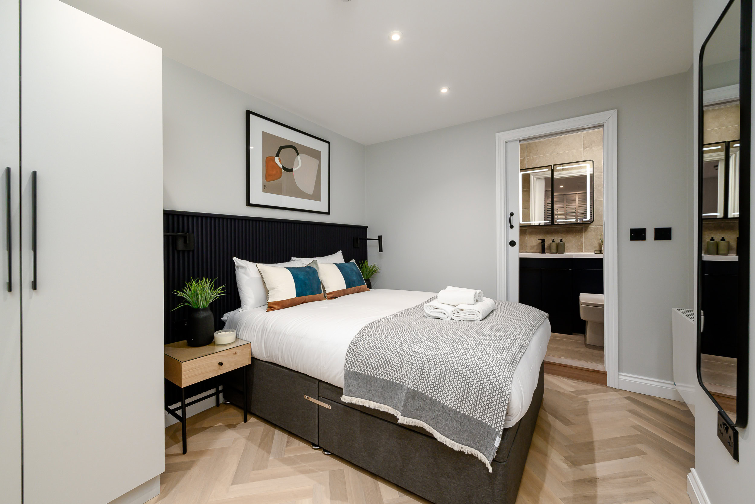 potted plant and ornament on side table