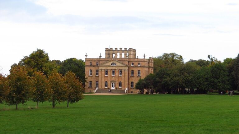 Kings Weston House across wide lawns with autumn trees