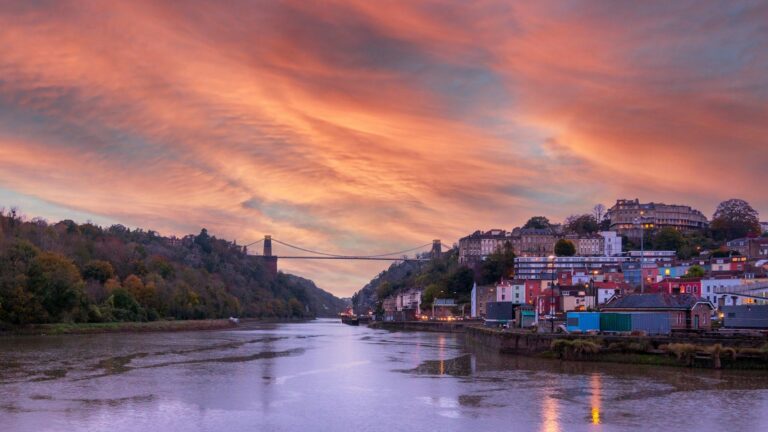 The Clifton Suspension Bridge at sunset, seen across the River Avon