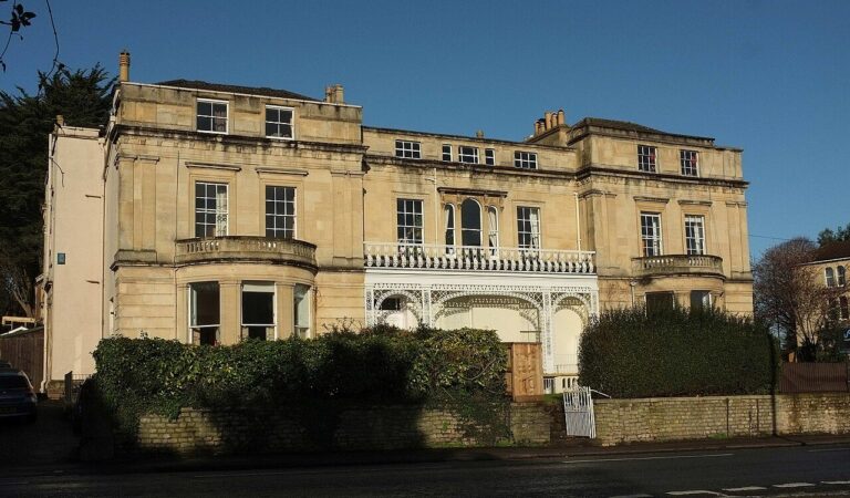 A listed stone terrace with an ironwork veranda in Cotham